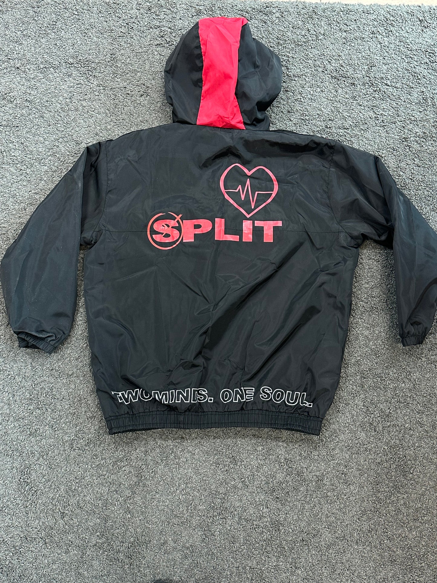 Split windbreaker black and red