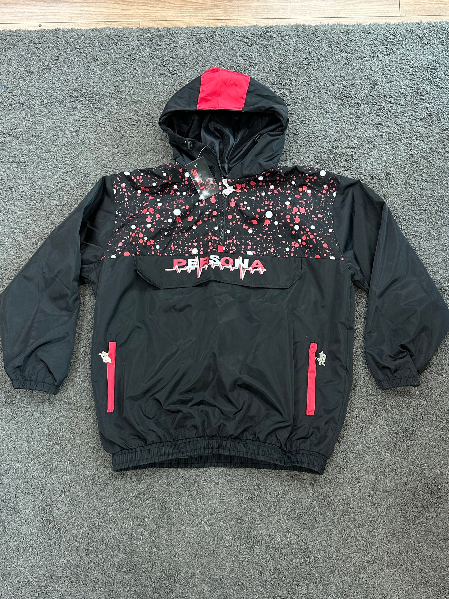 Split windbreaker black and red