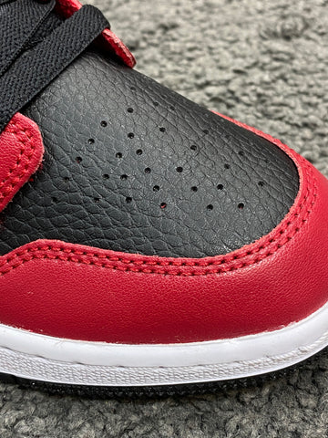 low jordan 1 red and black