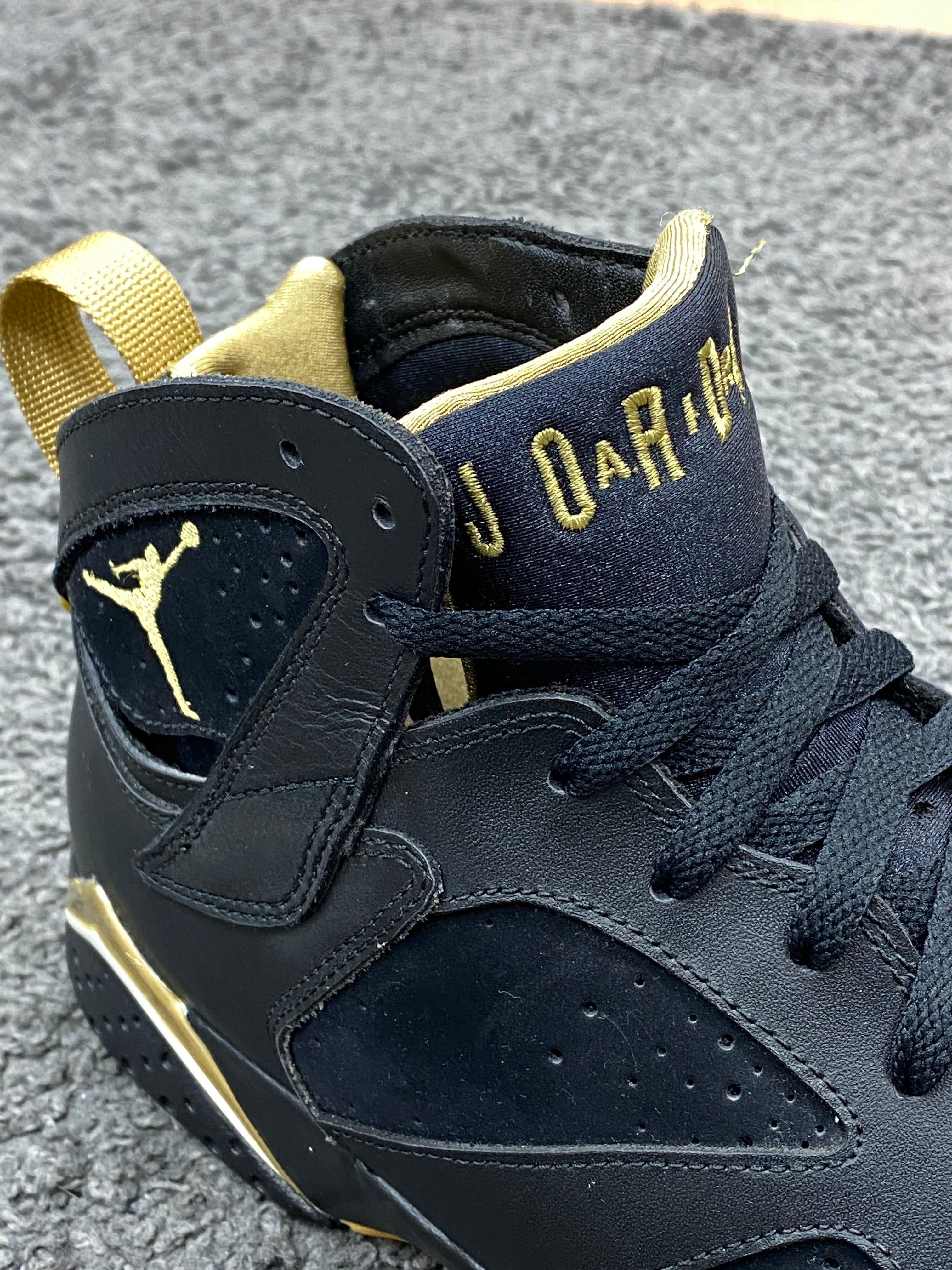 jordan 7s black and gold
